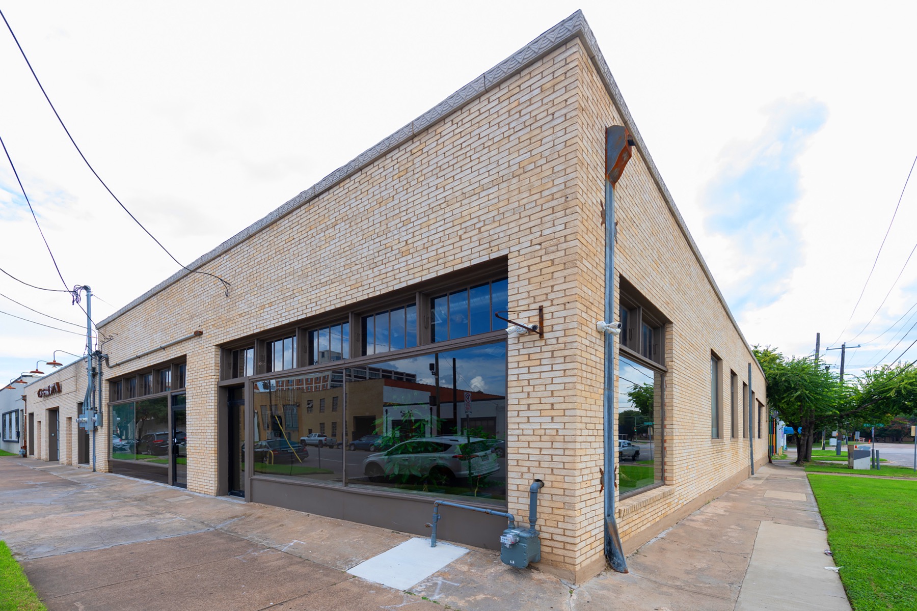 Brick storefront at the front of GeniusDen